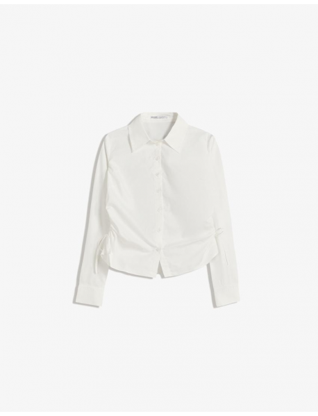 Yanı büzgülü, dar kesim gömlek