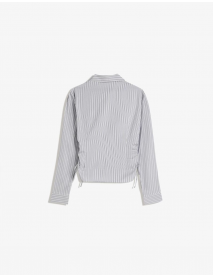 Yanı büzgülü, dar kesim gömlek