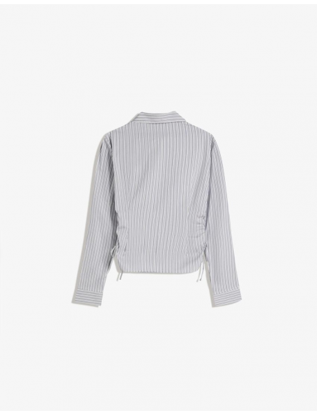 Yanı büzgülü, dar kesim gömlek