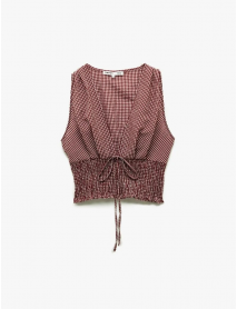 Koton X Melis Ağazat - Kolsuz V Yaka Fiyonklu Gipeli Pötikareli Kısa Bluz